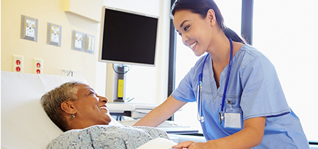 A nurse is talking to a patient in the hospital.